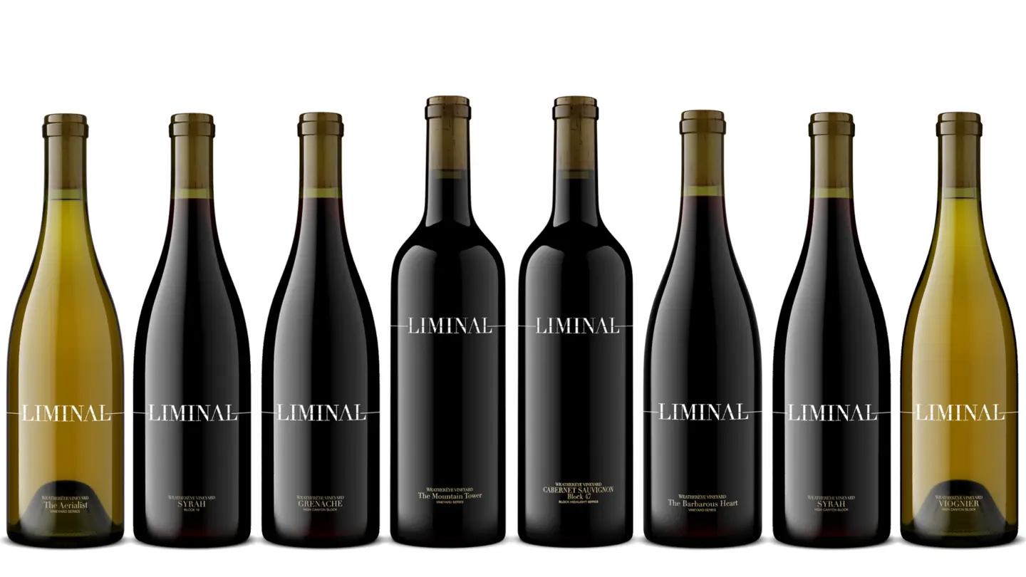 Eight wine bottles labeled "Liminal" in a row.